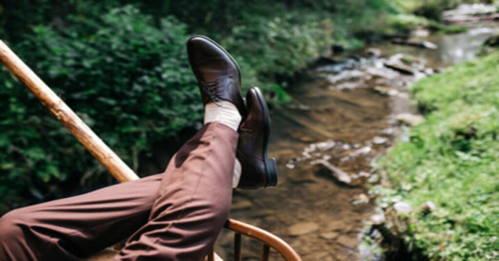 brown trousers black shoes​